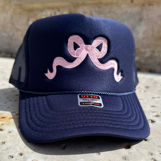 navy bow trucker hat