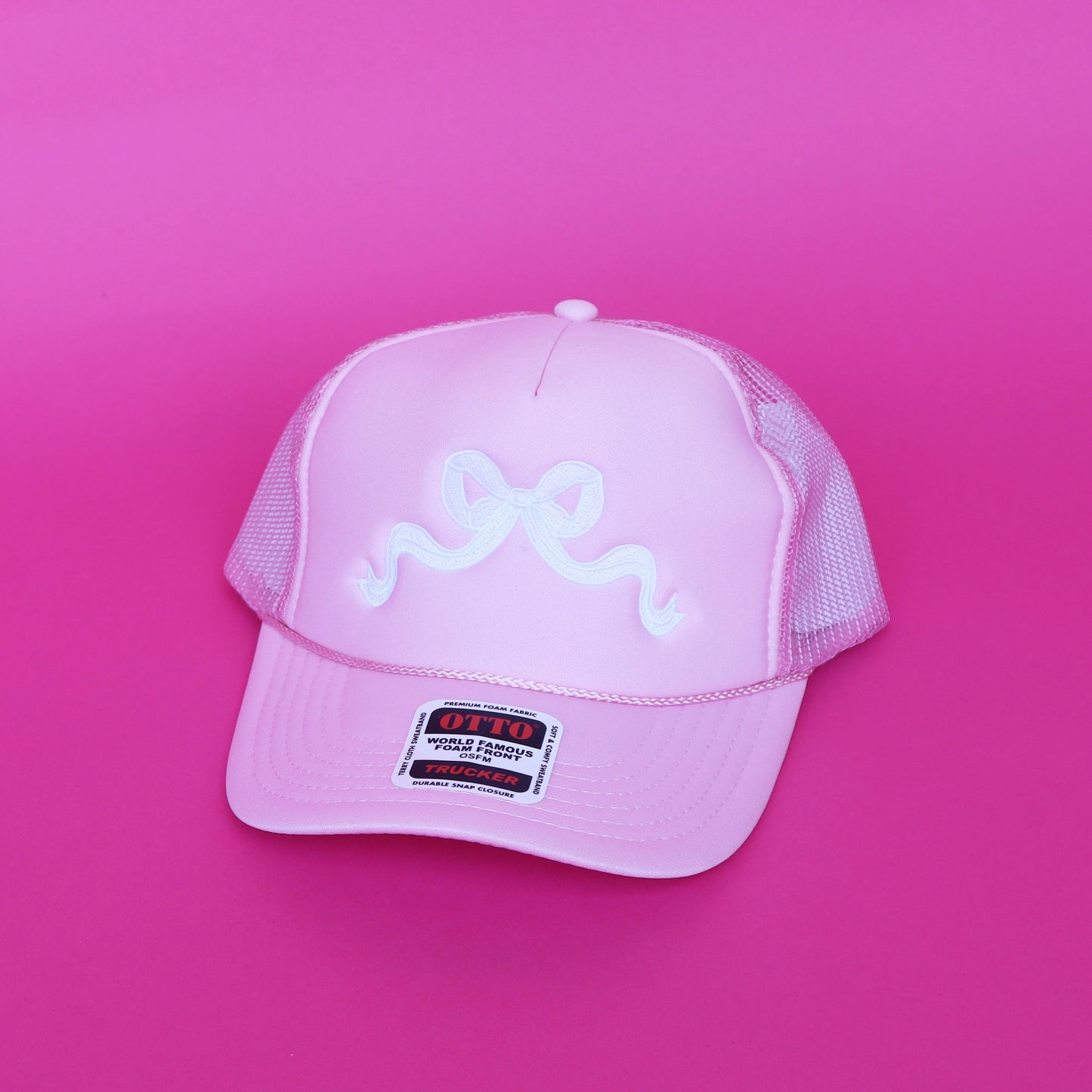 light pink bow trucker hat